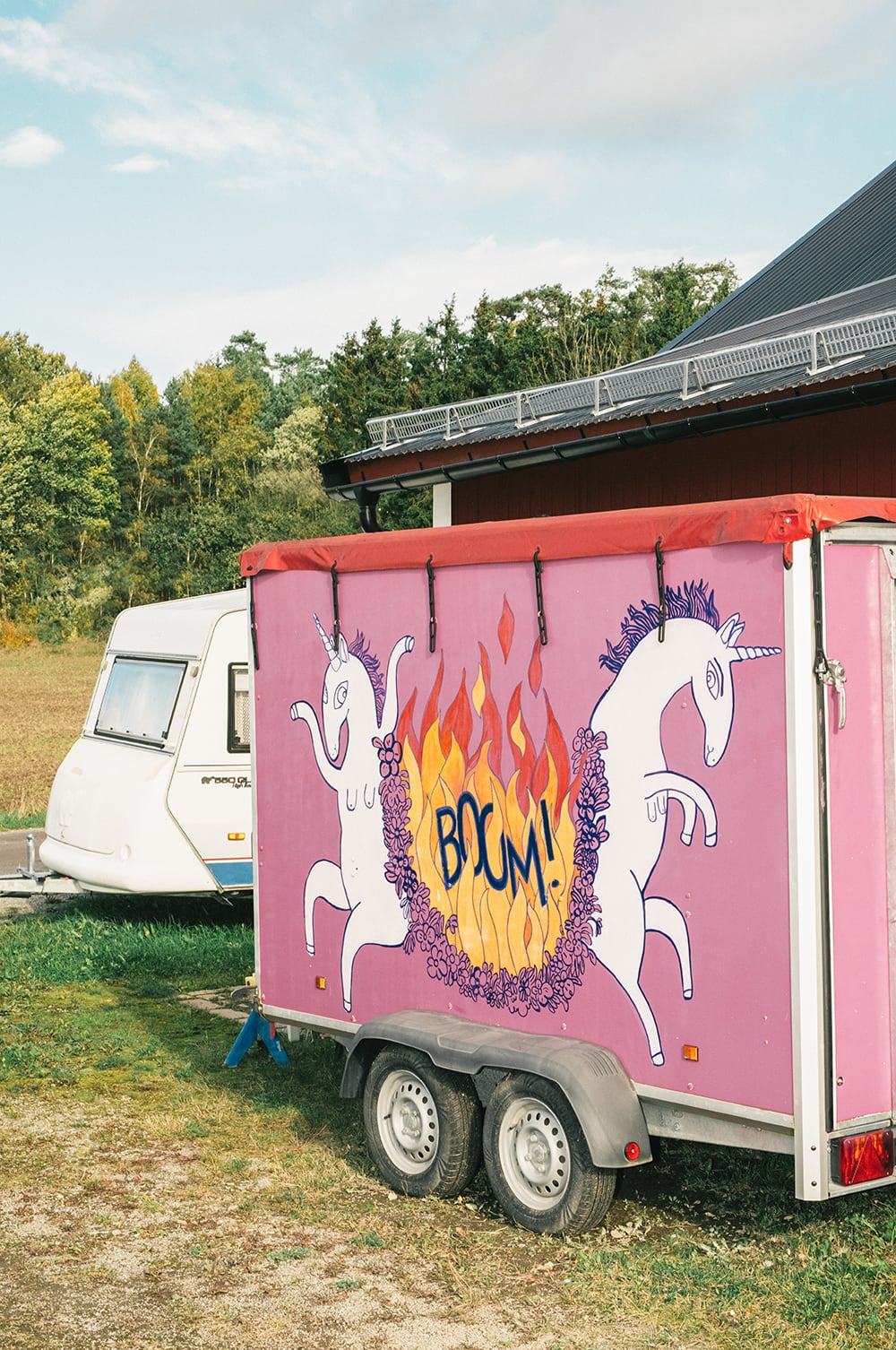 a pink trail with two unicorns painted on the side