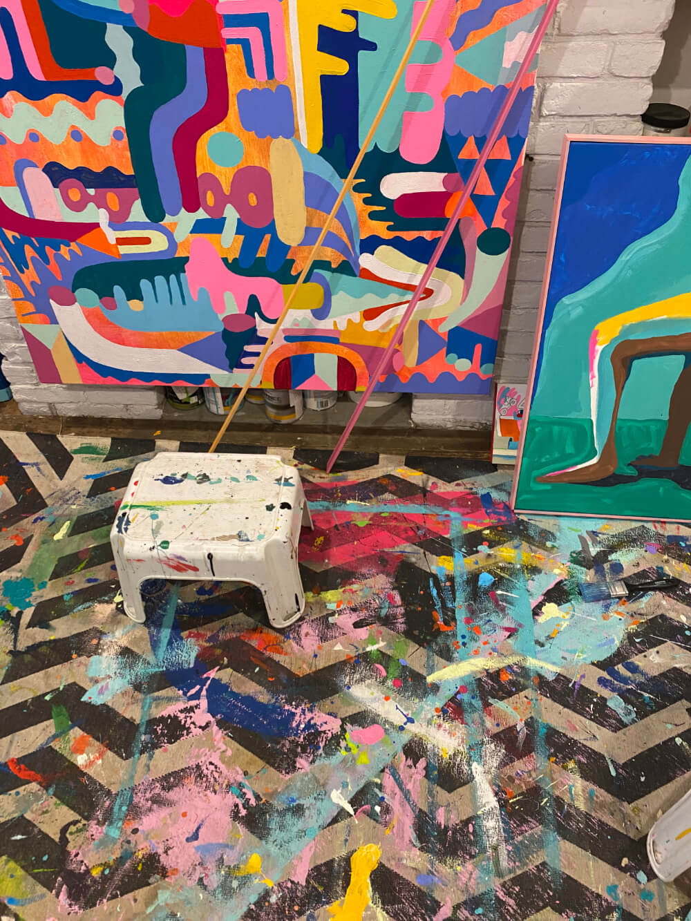 an image of Mike Perrys paintings in his studio